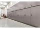 This large garage boasts wall-to-wall custom gray cabinets offering generous storage space at 38415 N 25Th Ave, Phoenix, AZ 85086