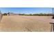 Long driveway with a detached three-car garage and desert landscaping on a sunny day at 38415 N 25Th Ave, Phoenix, AZ 85086