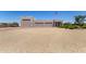 A detached three-car garage with desert landscaping on a sunny day at 38415 N 25Th Ave, Phoenix, AZ 85086
