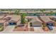 Aerial view of a charming home with a three-car garage, lovely landscaping, and curb appeal at 42485 W Abbey Rd, Maricopa, AZ 85138