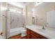 Well-lit bathroom with a shower/tub combo and a vanity with generous countertop space at 42485 W Abbey Rd, Maricopa, AZ 85138