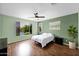 Bright bedroom with large windows and a ceiling fan at 42485 W Abbey Rd, Maricopa, AZ 85138