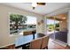 Dining area with large windows overlooking a lake at 42485 W Abbey Rd, Maricopa, AZ 85138