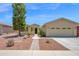 Charming single-story home with a two-car garage, well-maintained landscaping, and a welcoming entrance at 42485 W Abbey Rd, Maricopa, AZ 85138