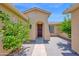 Welcoming front entrance featuring a stone walkway, well-maintained landscaping, and an inviting arched doorway at 42485 W Abbey Rd, Maricopa, AZ 85138