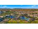 Stunning aerial view of a community pool, landscaping, green space, and mountain views on a bright day at 4341 E Evelyn St, Gilbert, AZ 85295