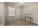 Minimal bedroom with a small desk and window, offering a serene space for rest or study at 4341 E Evelyn St, Gilbert, AZ 85295