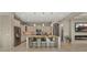 Beautiful kitchen featuring stainless steel appliances, granite countertops and a spacious island with seating at 4341 E Evelyn St, Gilbert, AZ 85295