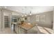 Kitchen island featuring a double sink and seating perfect for a quick meal at 4341 E Evelyn St, Gilbert, AZ 85295