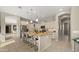 Bright eat-in kitchen featuring stainless steel appliances, granite countertops, and a large kitchen island at 4341 E Evelyn St, Gilbert, AZ 85295