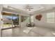 Bright living room features modern finishes, recessed lights, tile floors, and backyard access at 4341 E Evelyn St, Gilbert, AZ 85295