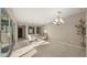 Bright open concept living area features a chandelier, tile floors and access to backyard at 4341 E Evelyn St, Gilbert, AZ 85295
