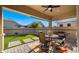 Charming covered patio overlooking the artificial turf yard, great for outdoor entertaining at 4341 E Evelyn St, Gilbert, AZ 85295