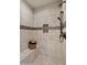 Detailed view of the shower showcasing the tiled walls, built-in niche, and modern fixtures at 4341 E Evelyn St, Gilbert, AZ 85295