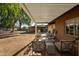 Outdoor patio with pergola, seating, fire pit, and backyard views at 547 W Orangewood Ave, Phoenix, AZ 85021