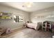 Cozy ' bedroom with cute decor, wood floors, window, and plenty of space for play at 547 W Orangewood Ave, Phoenix, AZ 85021