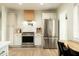 Modern kitchen with stainless steel appliances, and beautiful backsplash at 547 W Orangewood Ave, Phoenix, AZ 85021