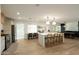 Open kitchen boasts a large island with seating and stylish decor at 547 W Orangewood Ave, Phoenix, AZ 85021
