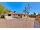 A spacious, fenced-in backyard that includes a covered patio area at 6040 N 31St Dr, Phoenix, AZ 85017