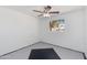 A bedroom with bright light coming through a window in a painted brick wall at 6040 N 31St Dr, Phoenix, AZ 85017
