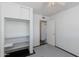 A bedroom with a closet featuring shelving and a doorway to another room at 6040 N 31St Dr, Phoenix, AZ 85017
