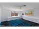 The bonus room has recessed lighting, unique carpet design, and multiple windows for plenty of sunlight at 6040 N 31St Dr, Phoenix, AZ 85017