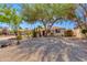This single story home has mature landscaping with trees and desert plants in a xeriscaped setting at 6040 N 31St Dr, Phoenix, AZ 85017