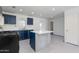 The kitchen features stainless steel appliances, ample cabinet space, and plenty of room to move around at 6040 N 31St Dr, Phoenix, AZ 85017