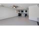 The living room of this home has a ceiling fan, tile floors, and it opens to the adjacent kitchen at 6040 N 31St Dr, Phoenix, AZ 85017
