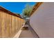 This side yard has a wooden bench, access gate, and a unique walkway perfect for a garden or a quiet escape at 6040 N 31St Dr, Phoenix, AZ 85017