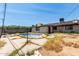 View of the backyard and pool area showcasing the house and surrounding fence at 6063 W Earll Dr, Phoenix, AZ 85033