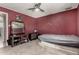 A bedroom features a bare mattress, a ceiling fan, and a small vanity at 6063 W Earll Dr, Phoenix, AZ 85033