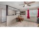 Cozy dining room featuring a ceiling fan, neutral walls, and tile flooring, creating a charming and comfortable space at 6063 W Earll Dr, Phoenix, AZ 85033