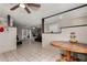 Open-concept dining area with tile flooring, natural light, and a seamless transition to the living space, ideal for gatherings at 6063 W Earll Dr, Phoenix, AZ 85033
