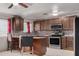 Spacious kitchen with stylish mosaic backsplash and stainless steel appliances at 6063 W Earll Dr, Phoenix, AZ 85033