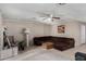 This home features a cozy living room with a ceiling fan and decorative fireplace at 6063 W Earll Dr, Phoenix, AZ 85033