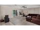 Cozy living room featuring a decorative fireplace and sliding glass door at 6063 W Earll Dr, Phoenix, AZ 85033