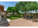 Expansive backyard featuring a pea gravel sitting area with comfortable seating arrangements at 6232 N 88Th Ave, Glendale, AZ 85305