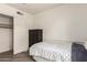 Simple bedroom featuring a single bed, a chest of drawers, and a closet at 6232 N 88Th Ave, Glendale, AZ 85305