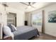 Bright bedroom featuring a full bed, window, hardwood floors and neutral colors at 6232 N 88Th Ave, Glendale, AZ 85305