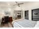 Spacious bedroom with hardwood floors, a work space, and an open entryway at 6232 N 88Th Ave, Glendale, AZ 85305