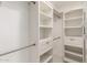 Walk-in closet featuring adjustable shelving, drawers and ample storage space at 6232 N 88Th Ave, Glendale, AZ 85305