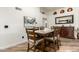 Dining room featuring wood floors, elegant decor and view of dining table at 6232 N 88Th Ave, Glendale, AZ 85305