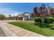 Beautiful home with a three-car garage, desert landscaping and well-maintained lawn at 6232 N 88Th Ave, Glendale, AZ 85305