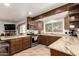 Updated kitchen with modern stainless steel appliances and granite counters at 6232 N 88Th Ave, Glendale, AZ 85305