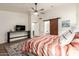 Spacious main bedroom with view to bathroom featuring barn door, and ample natural light at 6232 N 88Th Ave, Glendale, AZ 85305