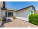 Private patio area with brick flooring and desert landscaping and partial home exterior at 6232 N 88Th Ave, Glendale, AZ 85305