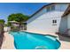 Sparkling backyard swimming pool with a surrounding patio, ideal for relaxation and outdoor enjoyment at 6232 N 88Th Ave, Glendale, AZ 85305
