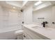 Bright bathroom features a shower-tub combination and vanity with black hardware at 6544 N 7Th Ave # 14, Phoenix, AZ 85013