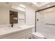 Modern bathroom featuring a sleek vanity with quartz countertops, a glass shower, and contemporary fixtures at 6544 N 7Th Ave # 14, Phoenix, AZ 85013